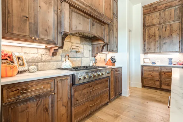 a view of a swimming pool with lawn chairs and a yard