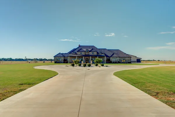 a living room with furniture and large window
