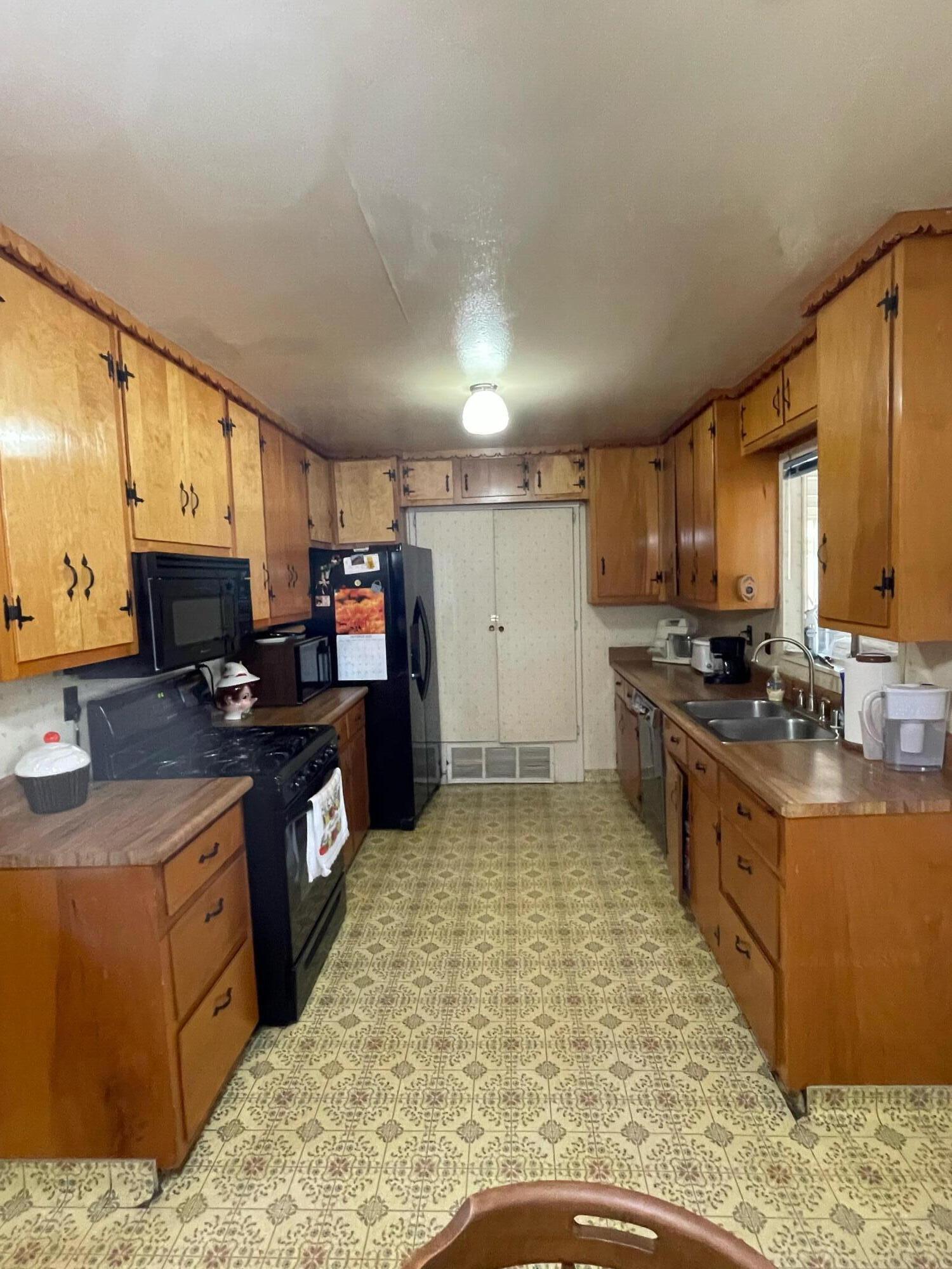 82785 Smoke Tree Avenue Indio, CA 92201 - Photo 2 of 7 a kitchen with stainless steel appliances granite countertop a stove refrigerator sink and cabinets