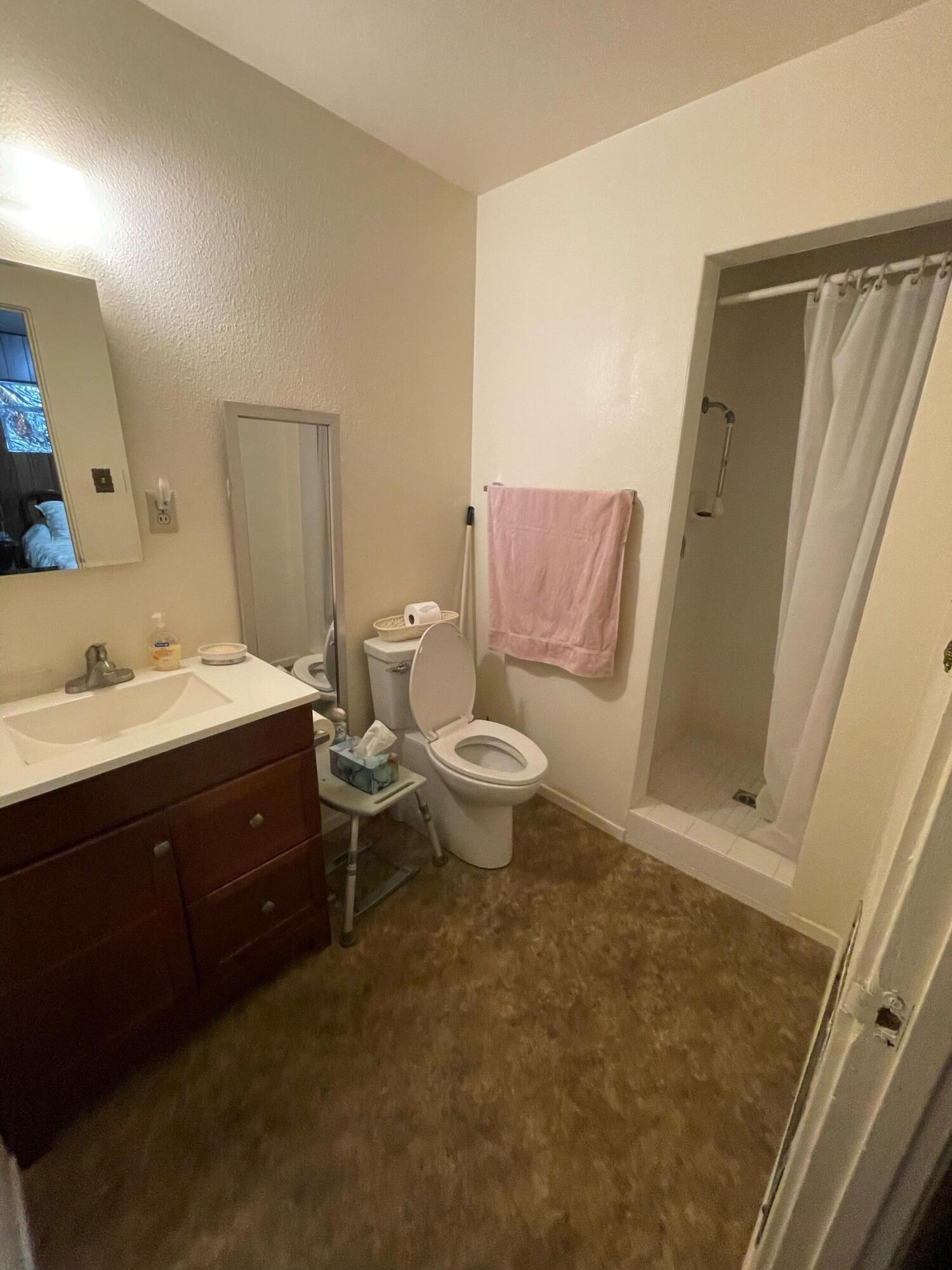 82785 Smoke Tree Avenue Indio, CA 92201 - Photo 4 of 7 a bathroom with a sink toilet and shower
