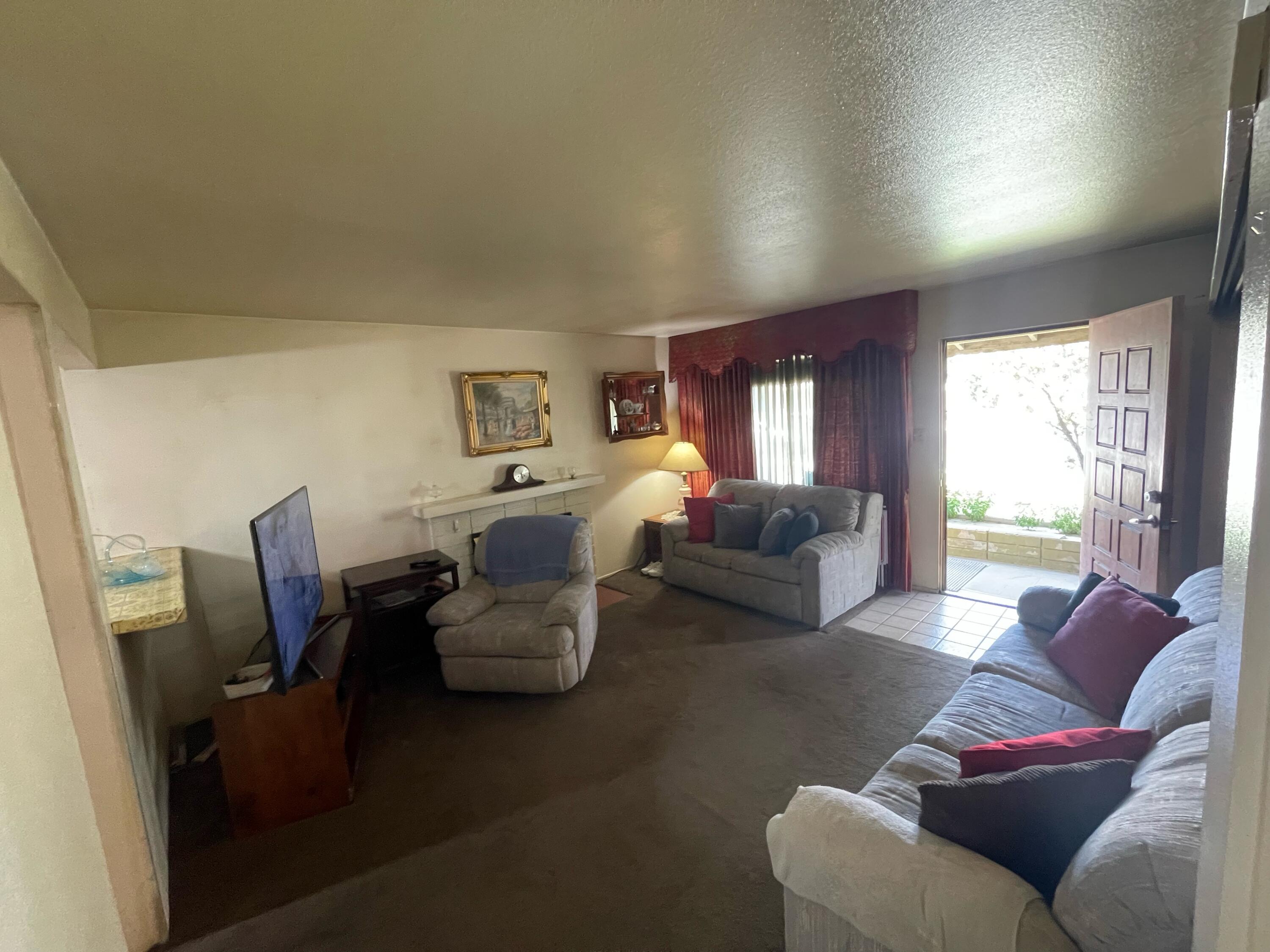 82785 Smoke Tree Avenue Indio, CA 92201 - Photo 7 of 7 a living room with furniture and a large window