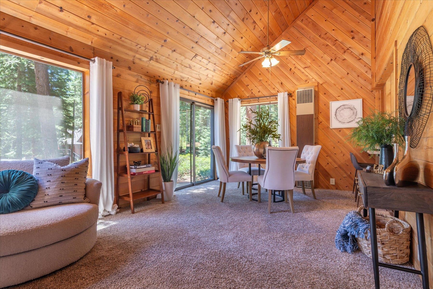325 North Ridge Road Carnelian Bay, CA 96140 - Photo 11 of 22 a living room with furniture and a floor to ceiling window