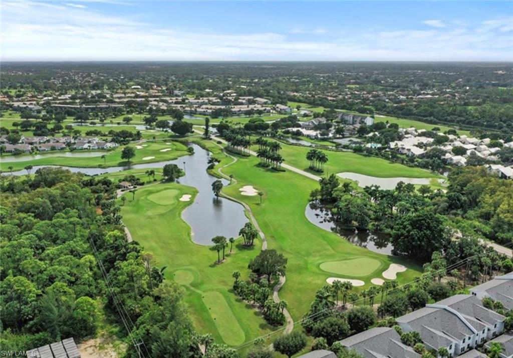 Bird's eye view with golf course view and a water view