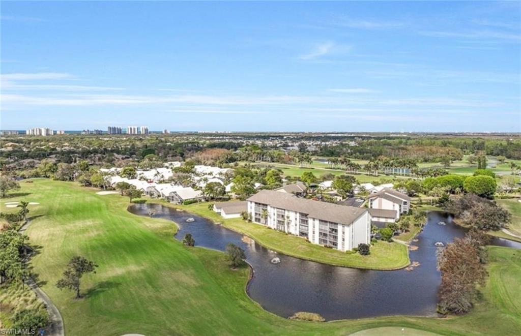 1530 Imperial Golf Course Boulevard, Unit 321 Naples, FL 34110 - Photo 6 of 19 Aerial view featuring a water view and view of golf course
