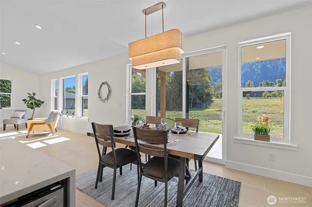a dining room with furniture and window
