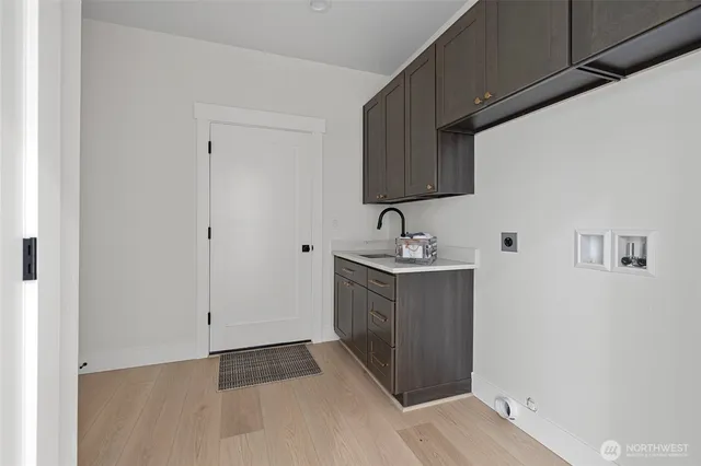 a kitchen with sink and cabinets