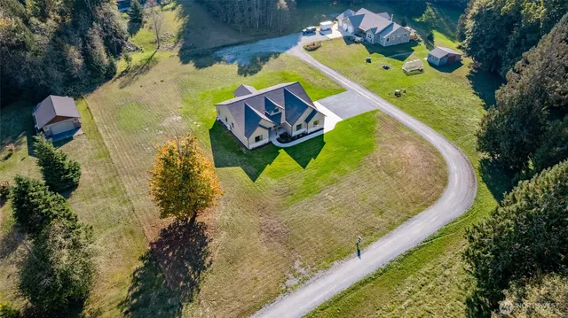 a view of a swimming pool with a yard