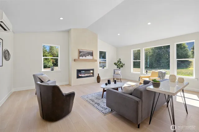 a living room with furniture and a large window