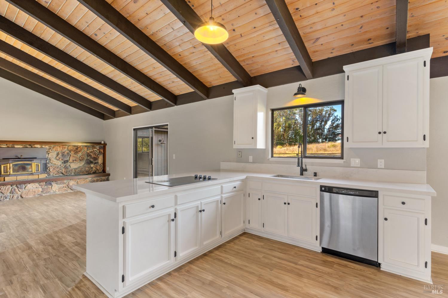 5 Mc Donald Lane Point Reyes Station, CA 94956 - Photo 14 of 48 a view of a kitchen with a sink window and cabinets