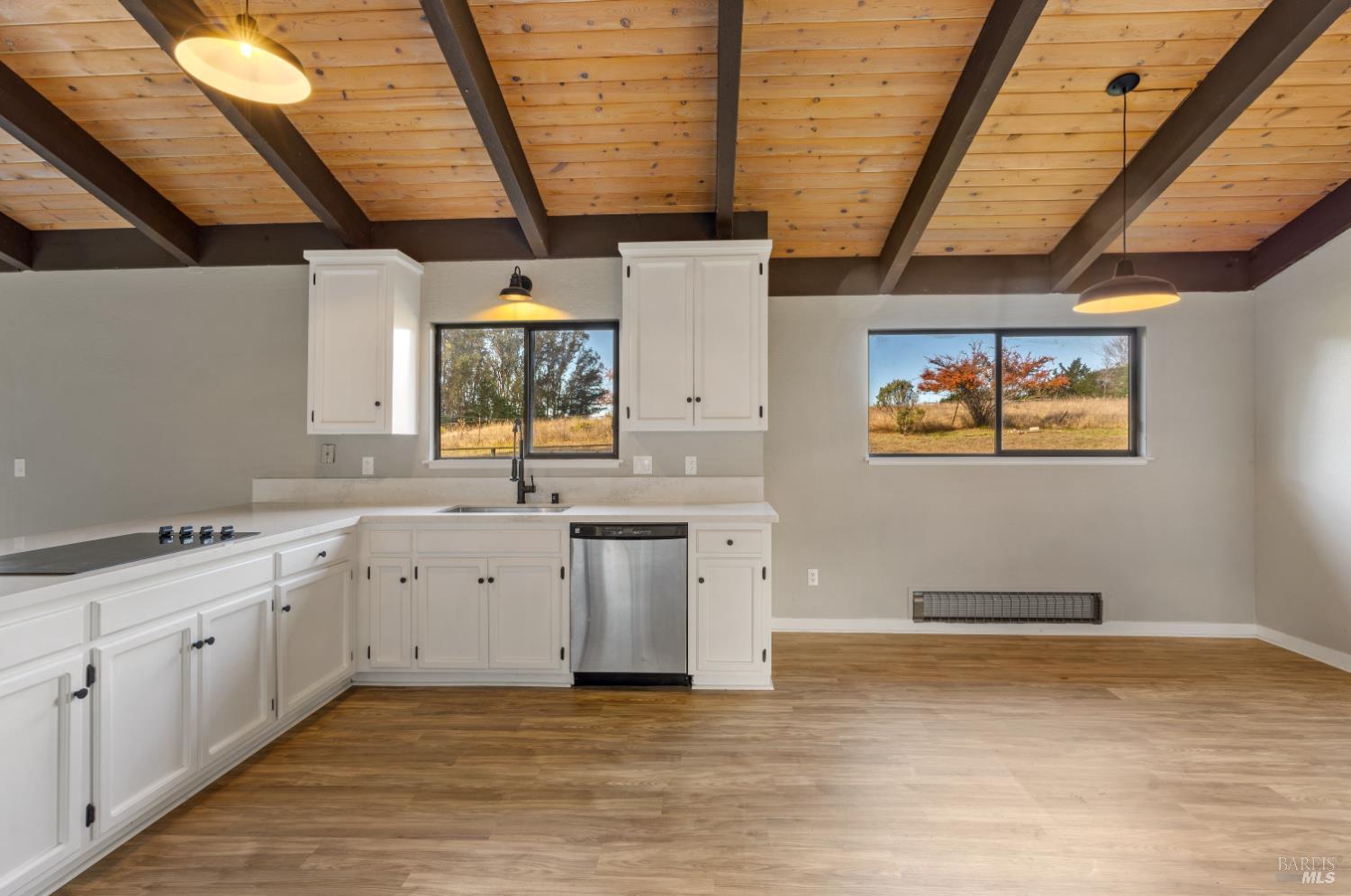 5 Mc Donald Lane Point Reyes Station, CA 94956 - Photo 15 of 48 a large kitchen with a sink a window and stainless steel appliances