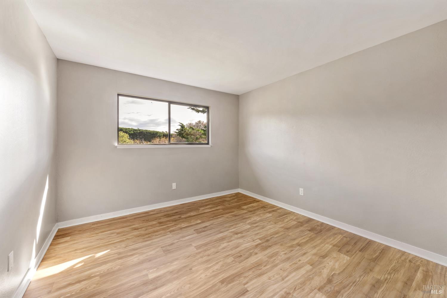 5 Mc Donald Lane Point Reyes Station, CA 94956 - Photo 24 of 48 a view of empty room with wooden floor and fan