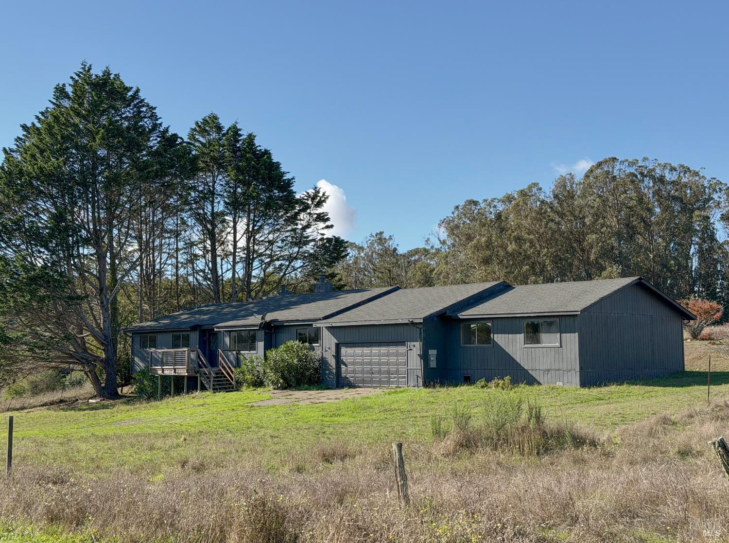 5 Mc Donald Lane Point Reyes Station, CA 94956 - Photo 44 of 48 a view of a house with wooden fence and large trees