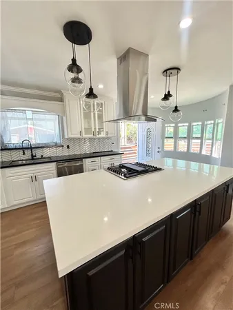 a kitchen with a counter space cabinets and appliances