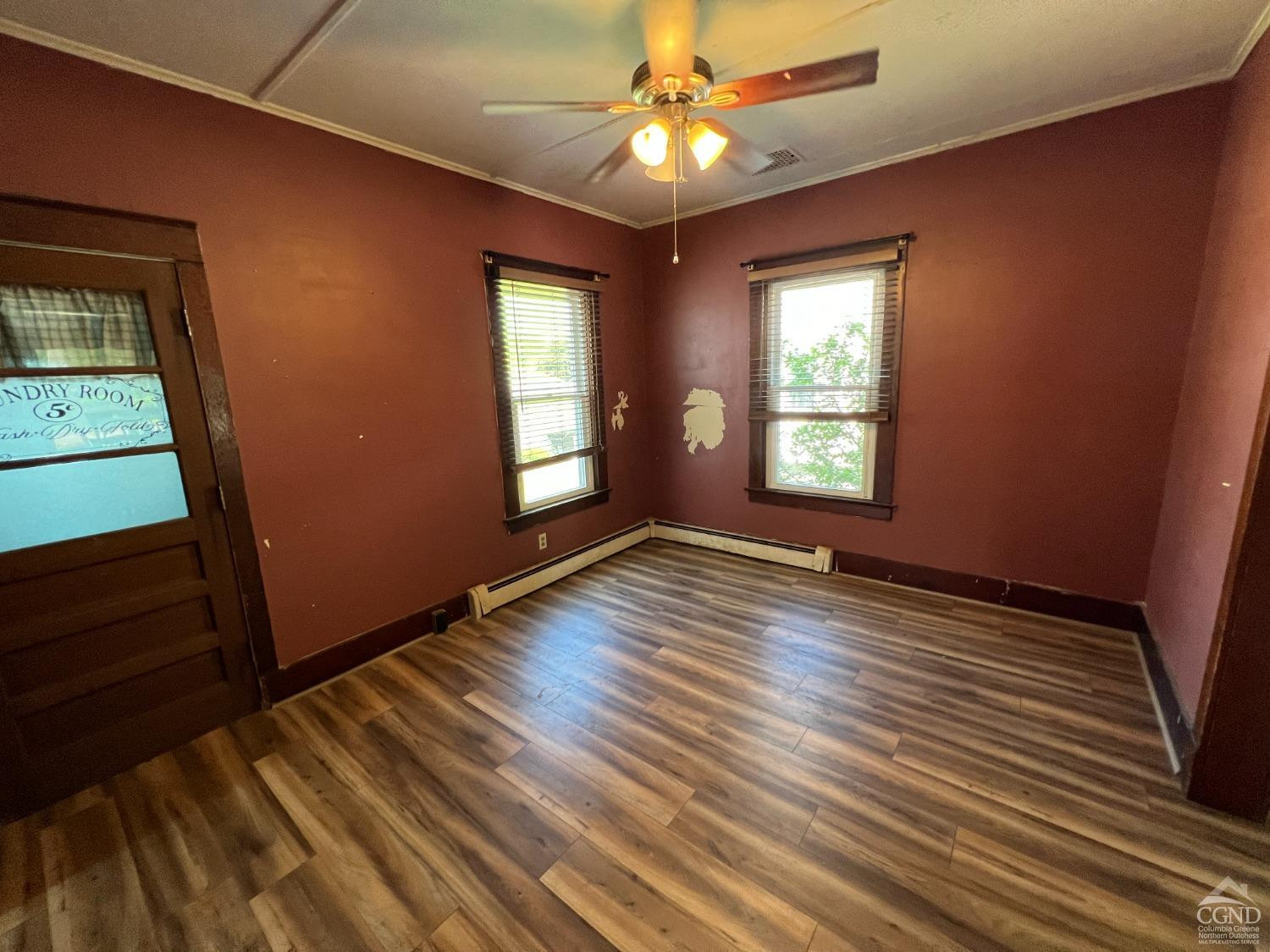 163 Spring Street Catskill, NY 12414 - Photo 11 of 36 a view of empty room with wooden floor and fan