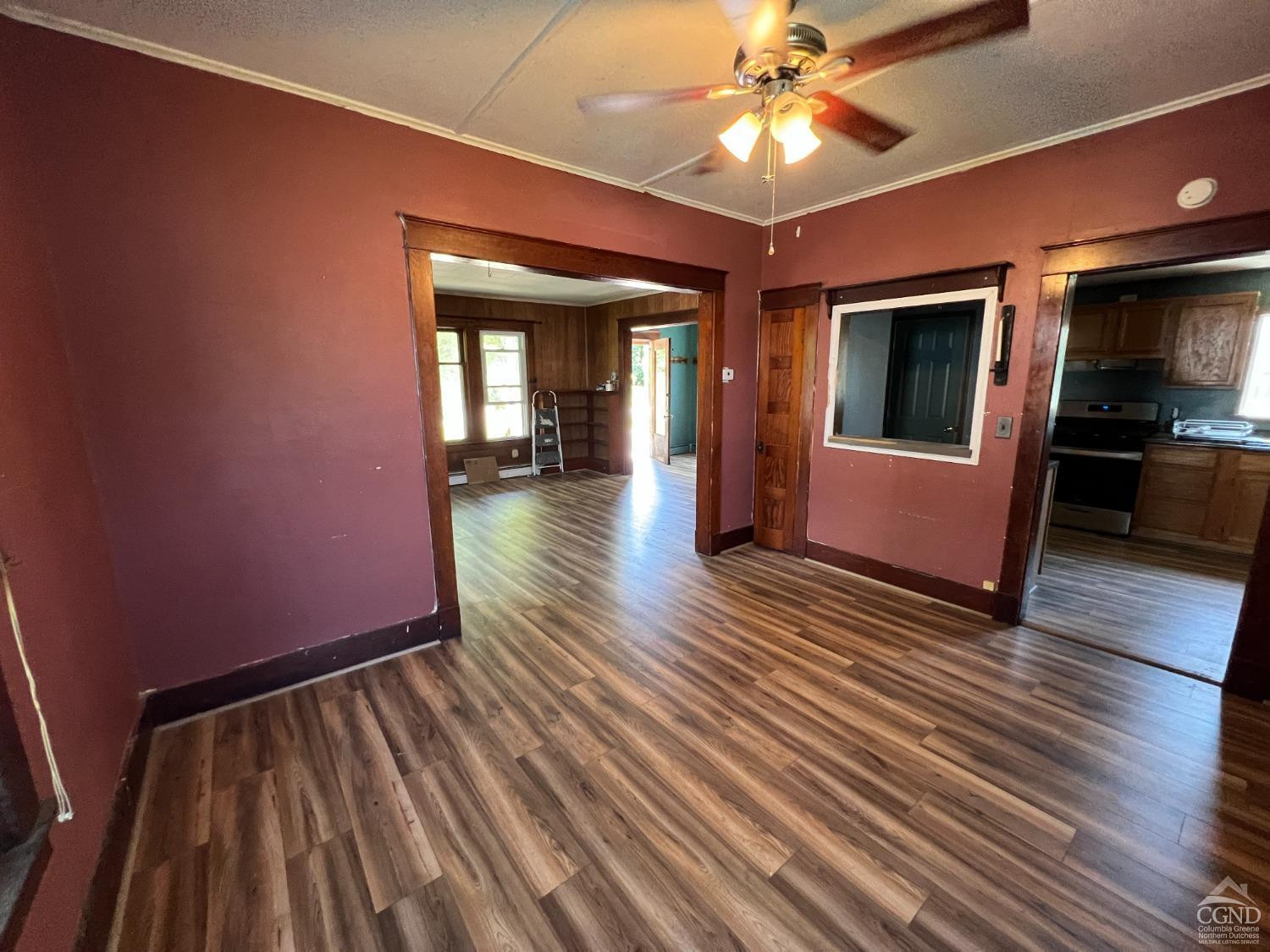 163 Spring Street Catskill, NY 12414 - Photo 12 of 36 a view of livingroom with hardwood floor and ceiling fan