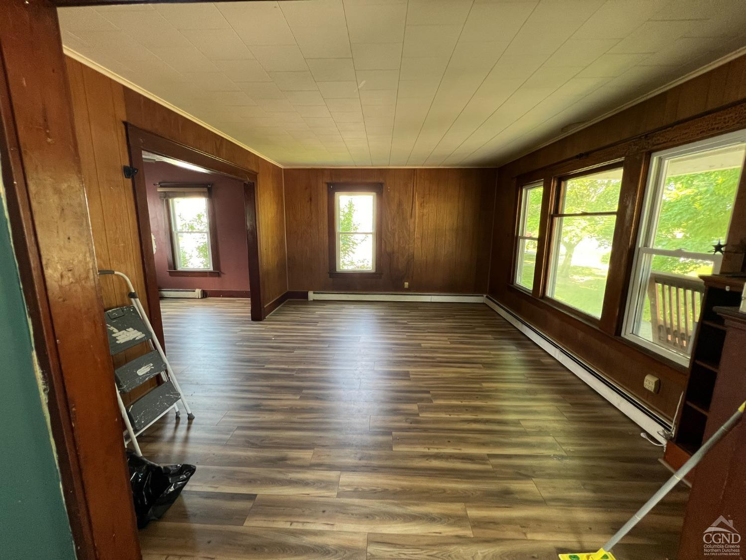 163 Spring Street Catskill, NY 12414 - Photo 17 of 36 a view of a room with wooden floor and chair