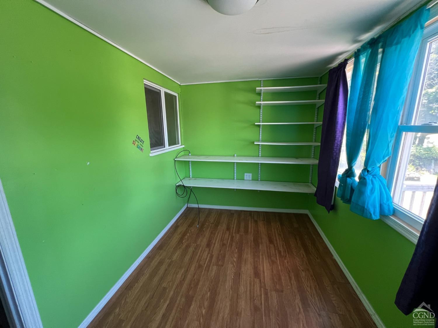 163 Spring Street Catskill, NY 12414 - Photo 29 of 36 a room with a window and a chair