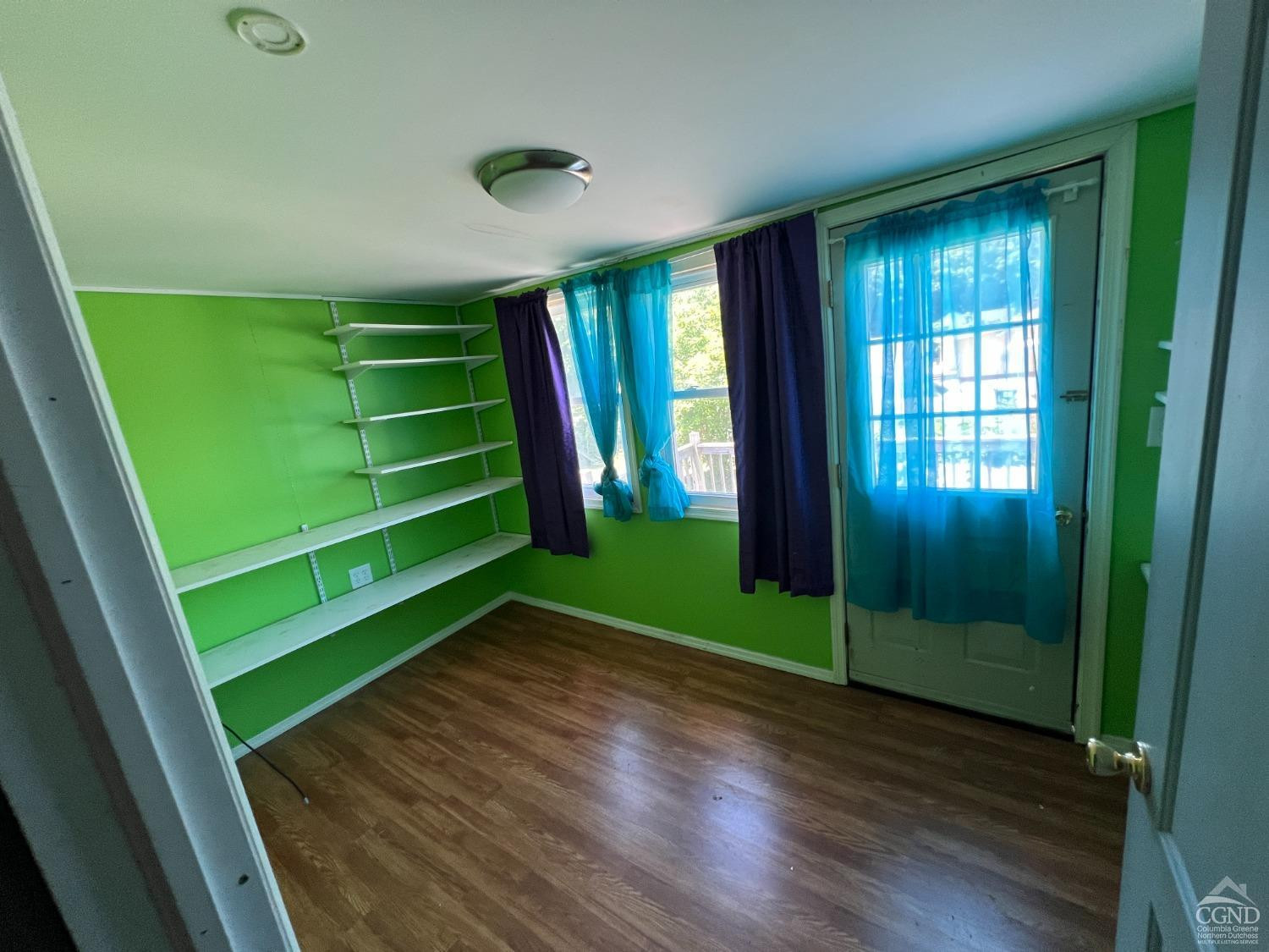 163 Spring Street Catskill, NY 12414 - Photo 30 of 36 a view of a room with window wooden floor and window
