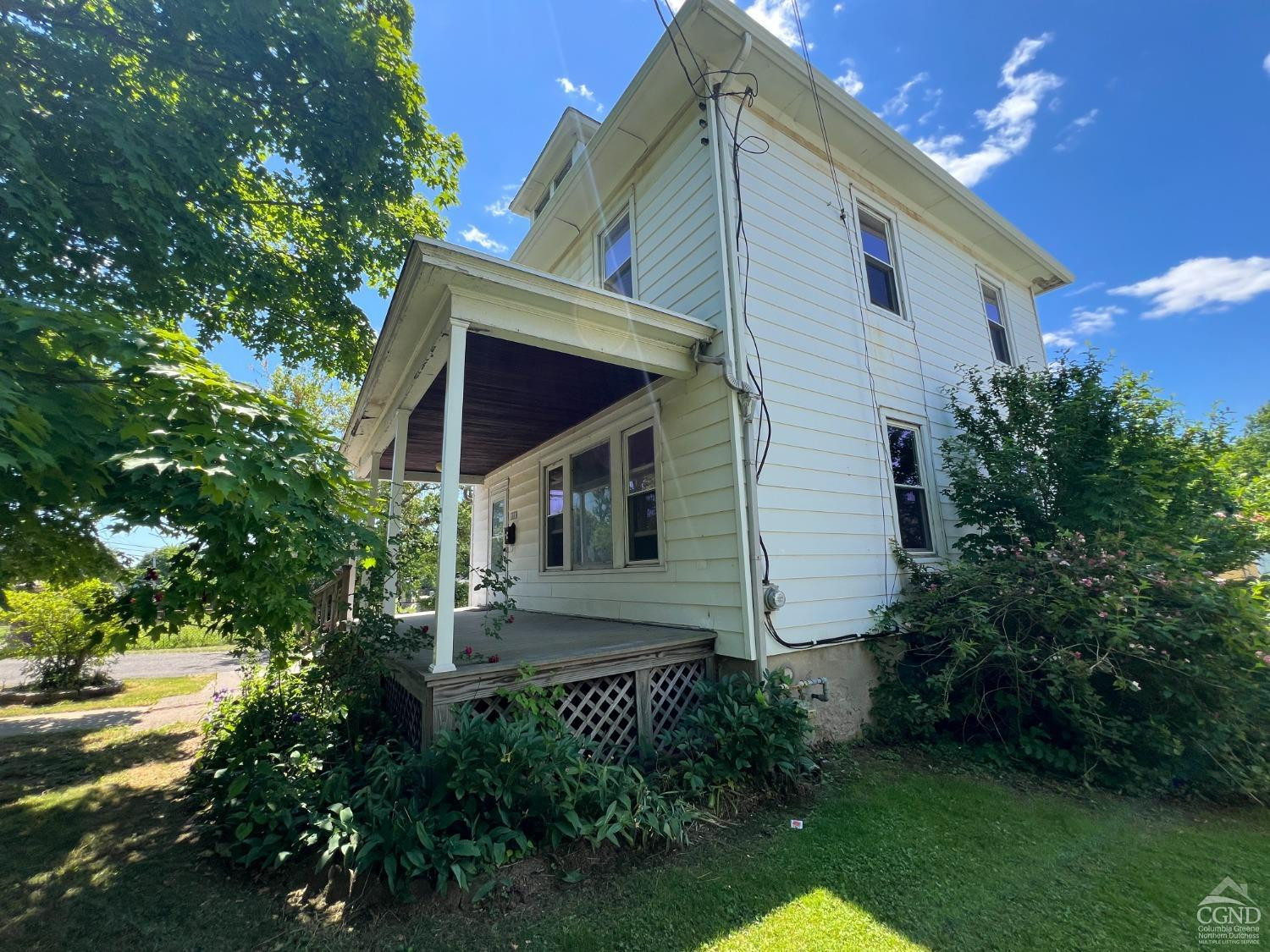 163 Spring Street Catskill, NY 12414 - Photo 3 of 36 a front view of a house with garden