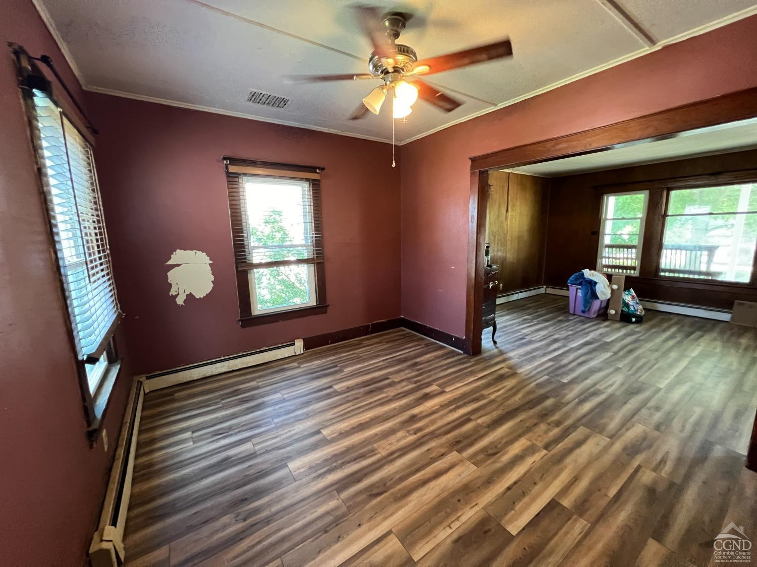 163 Spring Street Catskill, NY 12414 - Photo 9 of 36 wooden floor in an empty room with a window