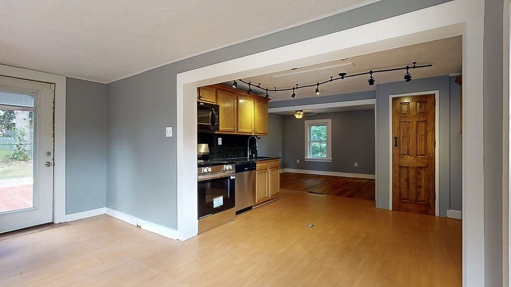10 Overlook Avenue Charlton, MA 01507 - Photo 11 of 40 a kitchen with granite countertop a refrigerator and stove top oven