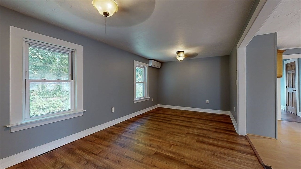 10 Overlook Avenue Charlton, MA 01507 - Photo 14 of 40 a view of an empty room with window and wooden floor