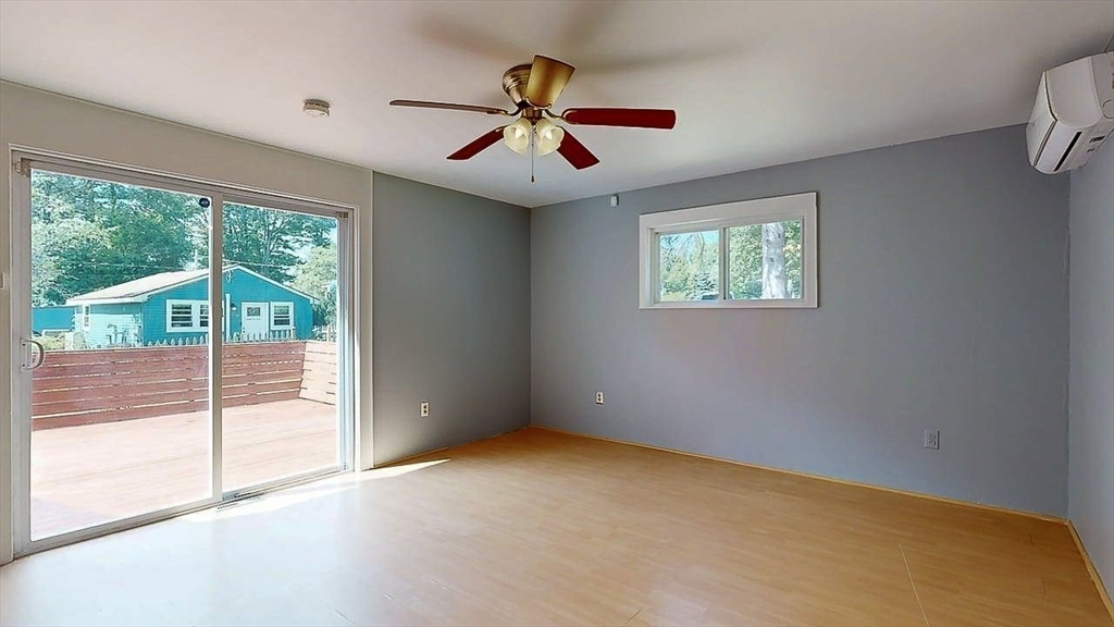 10 Overlook Avenue Charlton, MA 01507 - Photo 15 of 40 an empty room with windows and fan