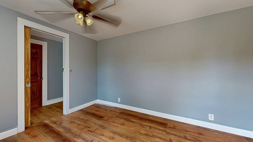 10 Overlook Avenue Charlton, MA 01507 - Photo 20 of 40 a view of empty room with wooden floor and fan