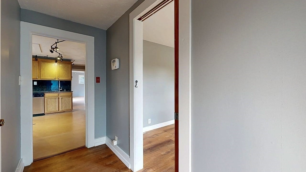 10 Overlook Avenue Charlton, MA 01507 - Photo 23 of 40 a view of a living room with a flat tv screen and a refrigerator