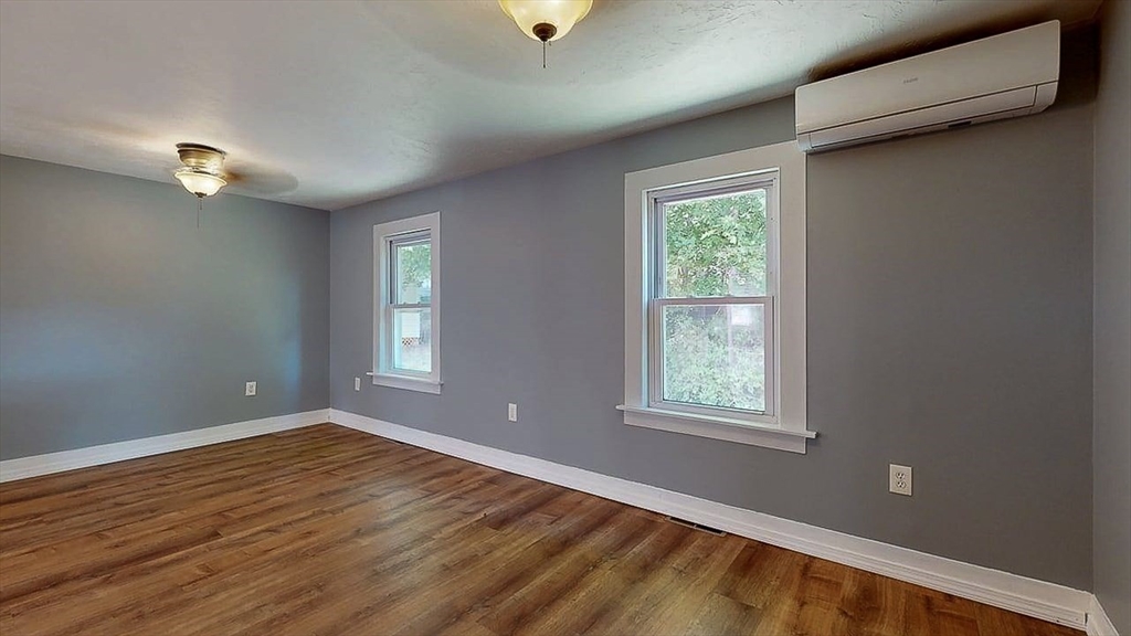 10 Overlook Avenue Charlton, MA 01507 - Photo 24 of 40 a view of an empty room with wooden floor and a window