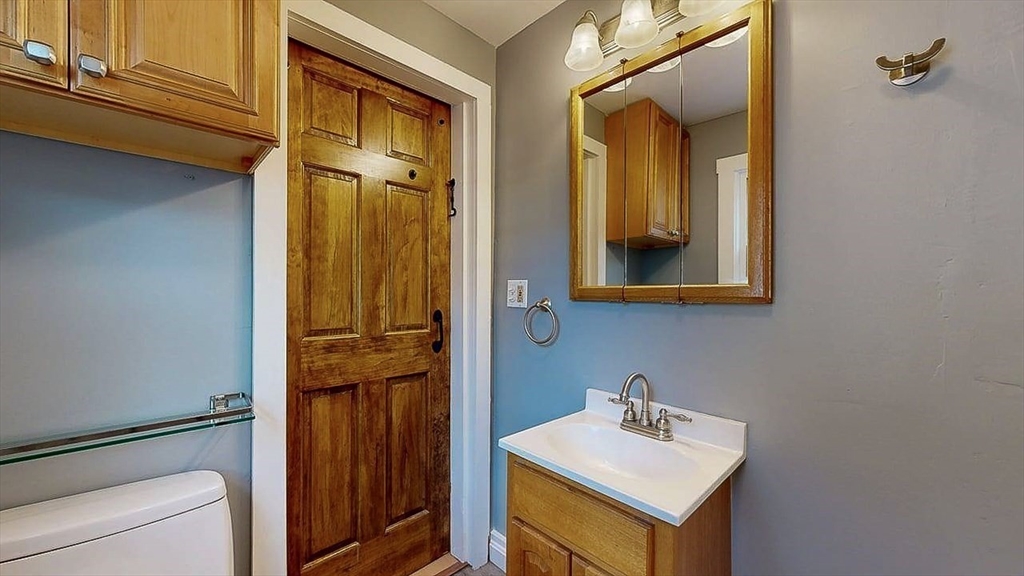 10 Overlook Avenue Charlton, MA 01507 - Photo 25 of 40 a bathroom with a sink a mirror and shower