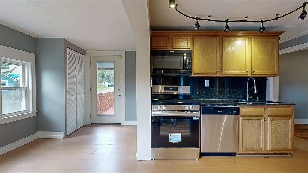 10 Overlook Avenue Charlton, MA 01507 - Photo 3 of 40 a kitchen with stainless steel appliances granite countertop a stove a sink and a microwave