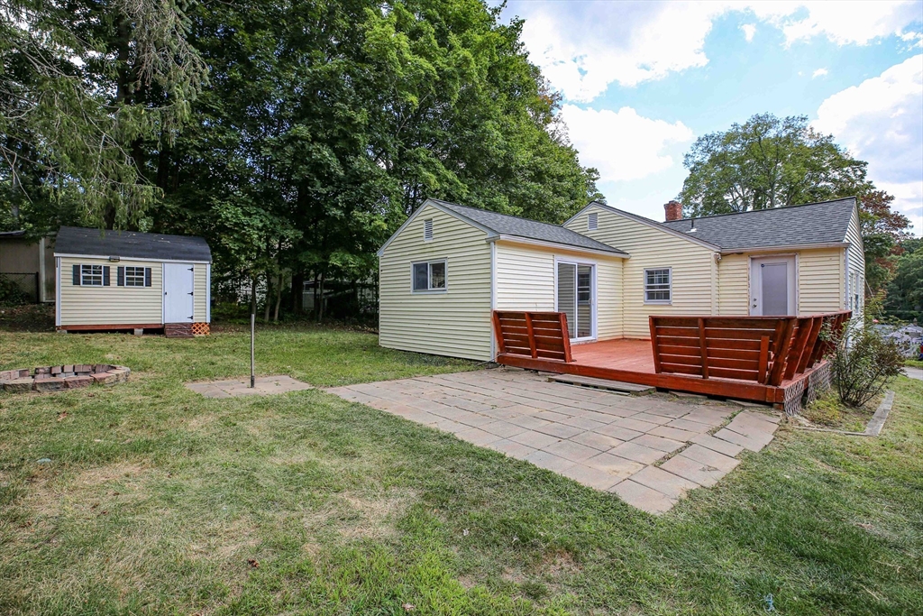 10 Overlook Avenue Charlton, MA 01507 - Photo 33 of 40 a view of backyard of house with wooden deck and trees