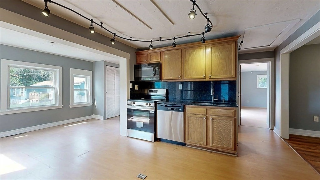 10 Overlook Avenue Charlton, MA 01507 - Photo 4 of 40 a kitchen with stainless steel appliances granite countertop a stove a sink and a refrigerator