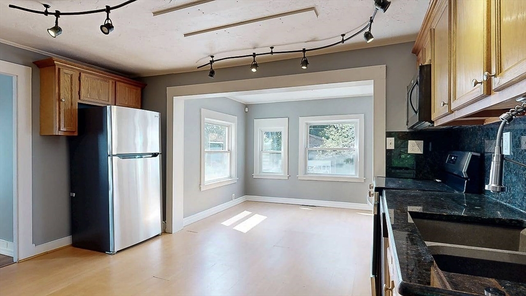 10 Overlook Avenue Charlton, MA 01507 - Photo 6 of 40 a kitchen with stainless steel appliances granite countertop a refrigerator a stove and a sink with large window