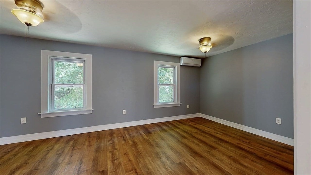 10 Overlook Avenue Charlton, MA 01507 - Photo 10 of 40 wooden floor in an empty room with a window