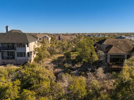 an aerial view of a house with outdoor space and street view