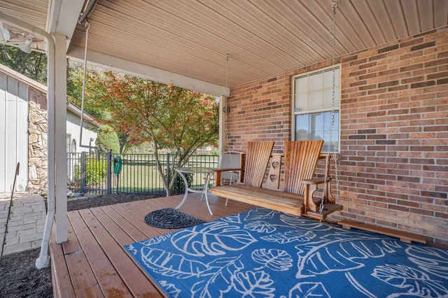 view of a house with a yard and garden