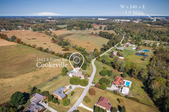 an aerial view of a house with a ocean view