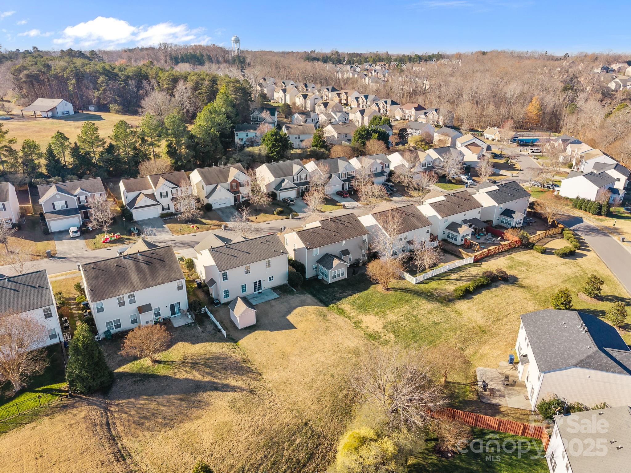 3422 Burnage Hall Road Harrisburg, NC 28075 - Photo 42 of 42 an aerial view of residential houses with outdoor space