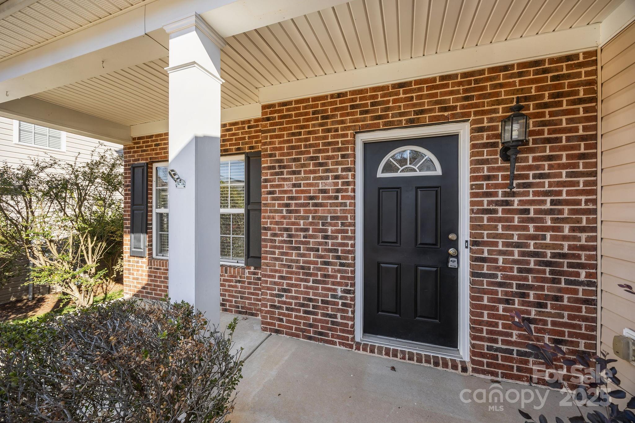 3422 Burnage Hall Road Harrisburg, NC 28075 - Photo 6 of 42 a front view of a building with a door