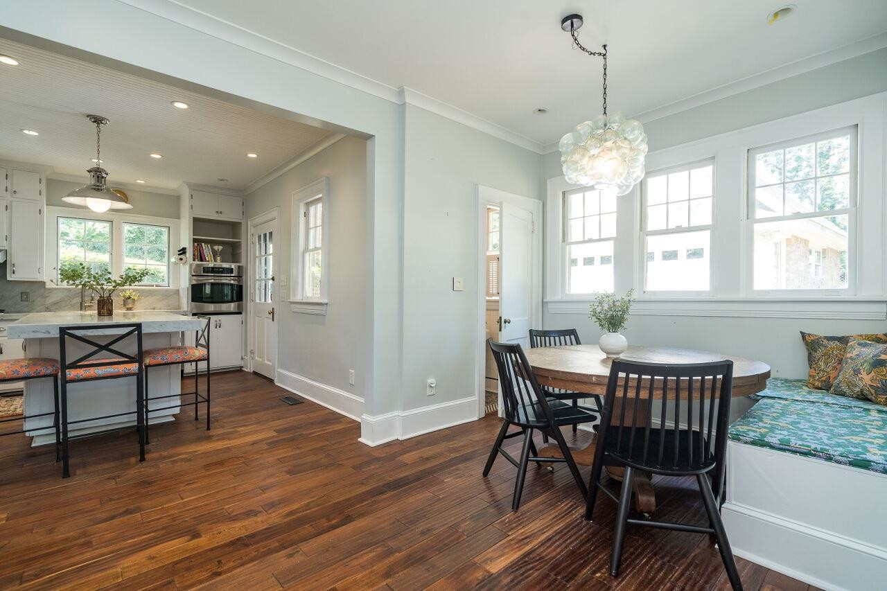13 Furches Street Raleigh, NC 27607 - Photo 18 of 37 a view of a dining room with furniture window and wooden floor