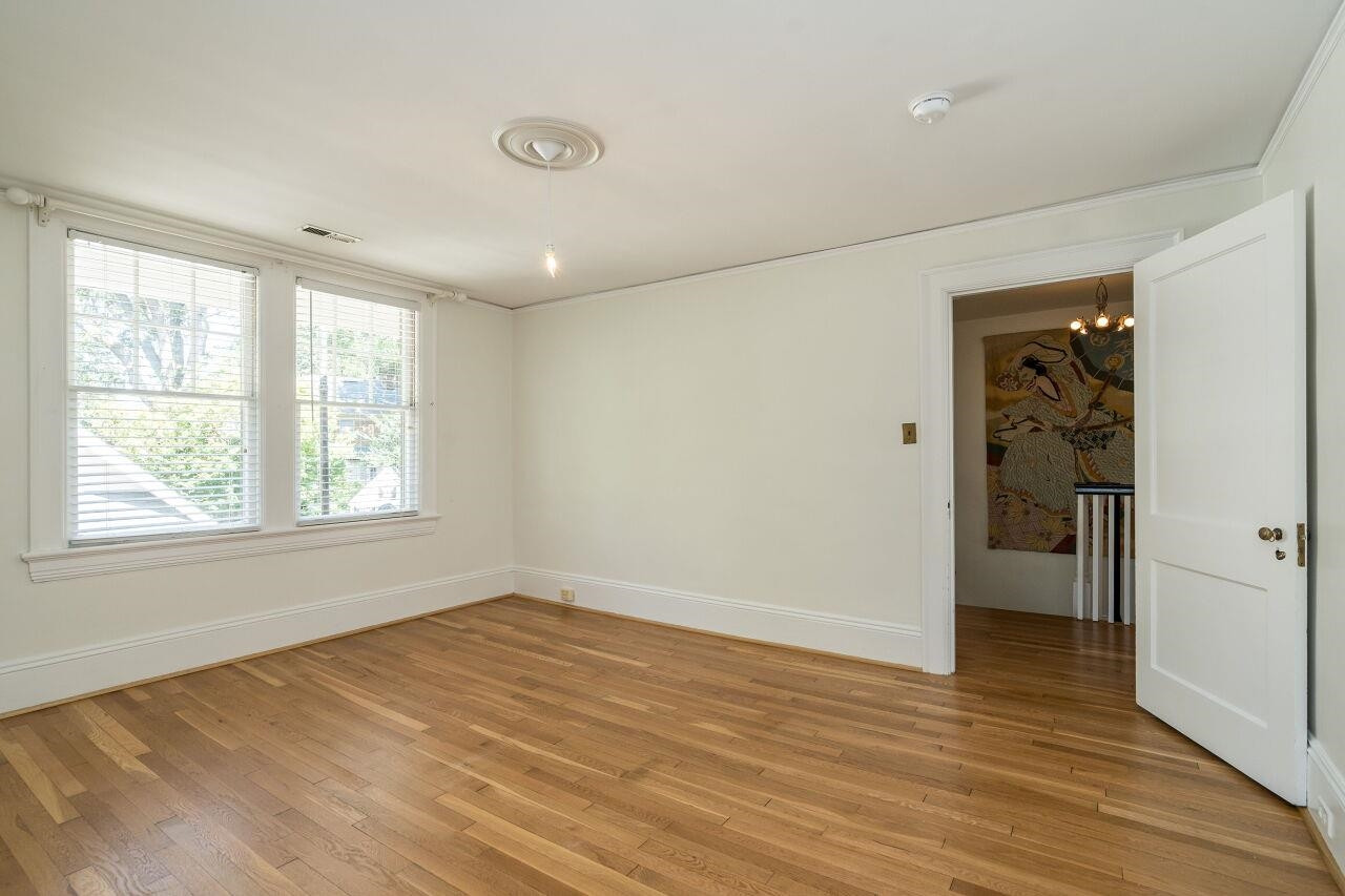 13 Furches Street Raleigh, NC 27607 - Photo 28 of 37 a view of empty room with wooden floor and fan