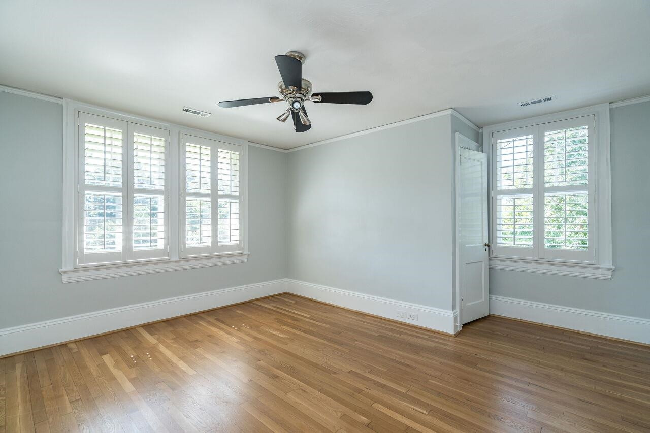 13 Furches Street Raleigh, NC 27607 - Photo 29 of 37 a view of empty room with wooden floor and fan