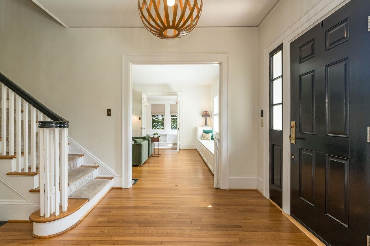 13 Furches Street Raleigh, NC 27607 - Photo 6 of 37 a view of a hallway view with wooden floor and staircase