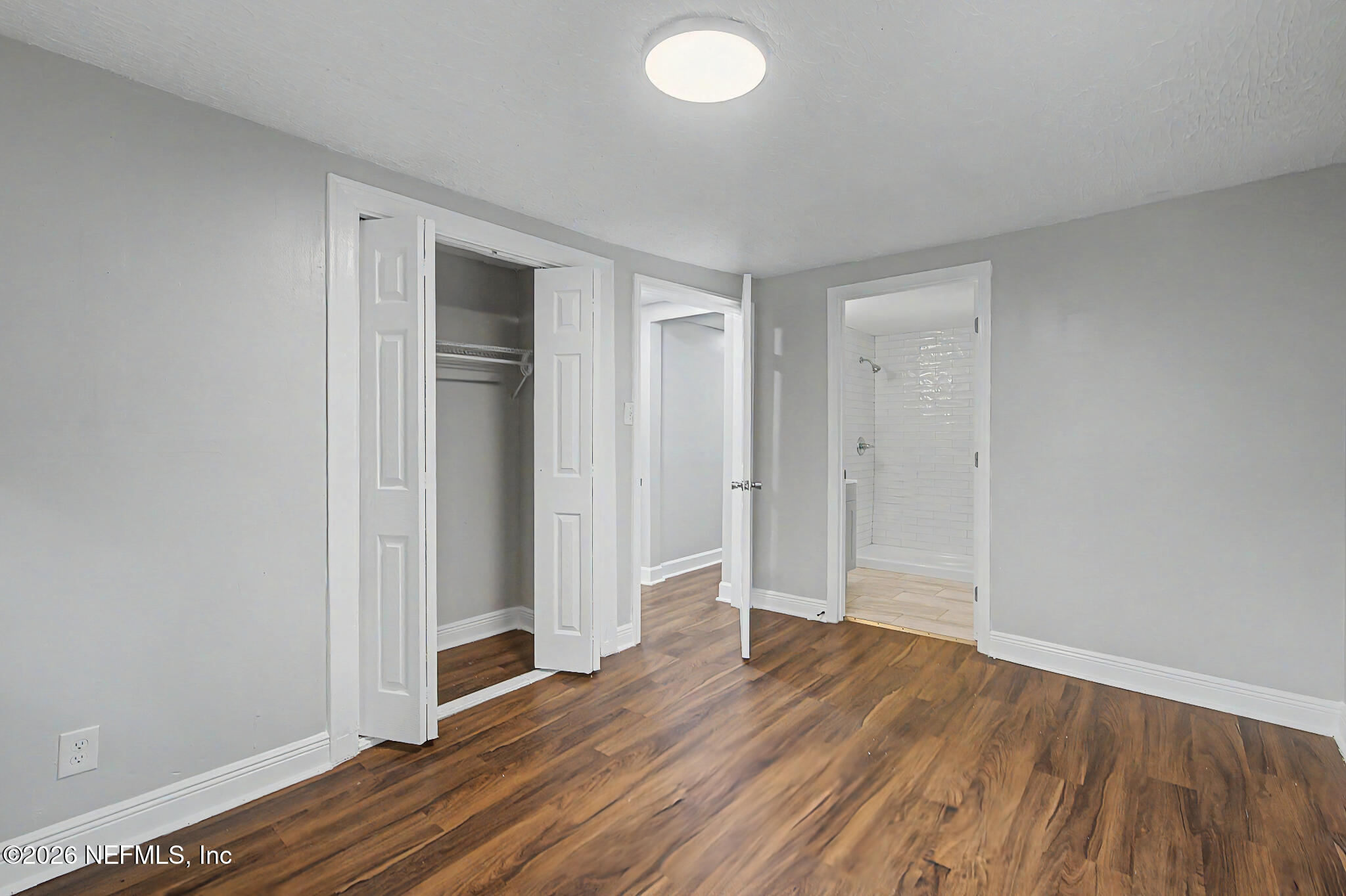 2625 Kohn Road Jacksonville, FL 32210 - Photo 21 of 34 an empty room with wooden floor and closet