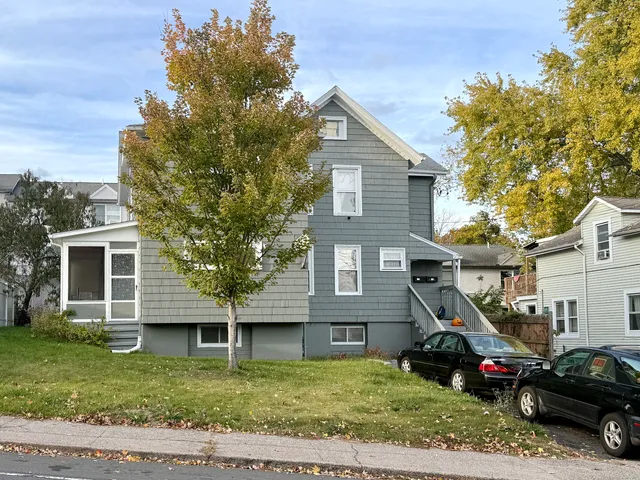 a view of a house with a yard