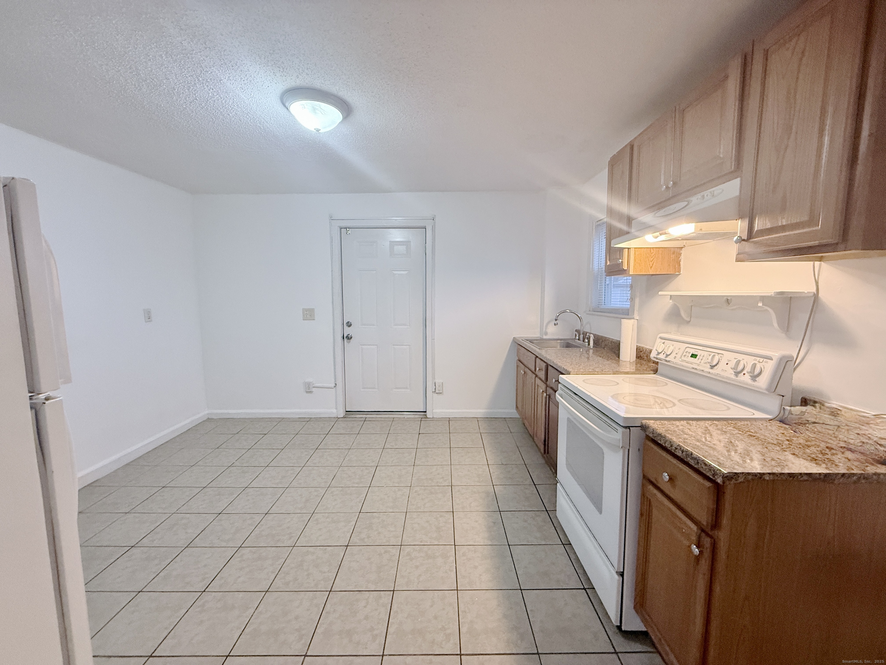 12 South Street New Britain, CT 06051 - Photo 3 of 9 a kitchen that has a sink and a stove