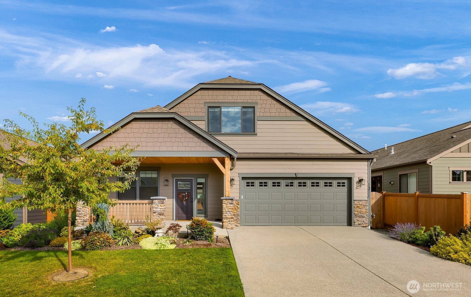 1396 Woods Point Loop Ferndale, WA 98248 - Photo 1 of 32 a front view of a house with a yard