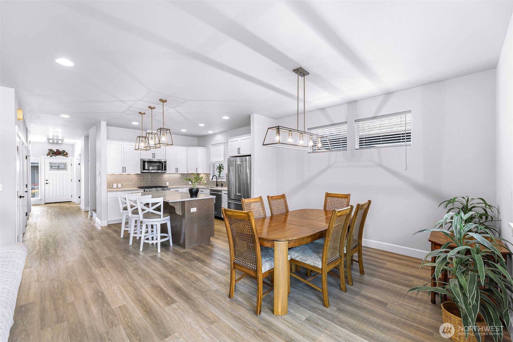 1396 Woods Point Loop Ferndale, WA 98248 - Photo 14 of 32 a view of a dining room with furniture and wooden floor